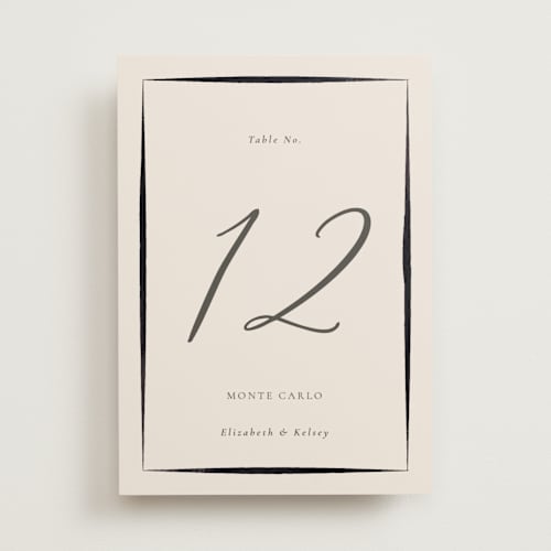 This is a tuxedo table numbers with foil pressed by Corinne Malesic called bow printing on doublethick in standard